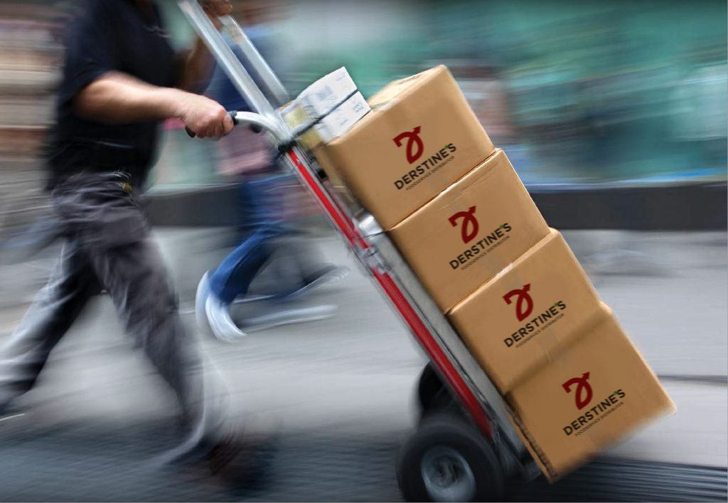 A hand truck with boxes labelled Derstine's